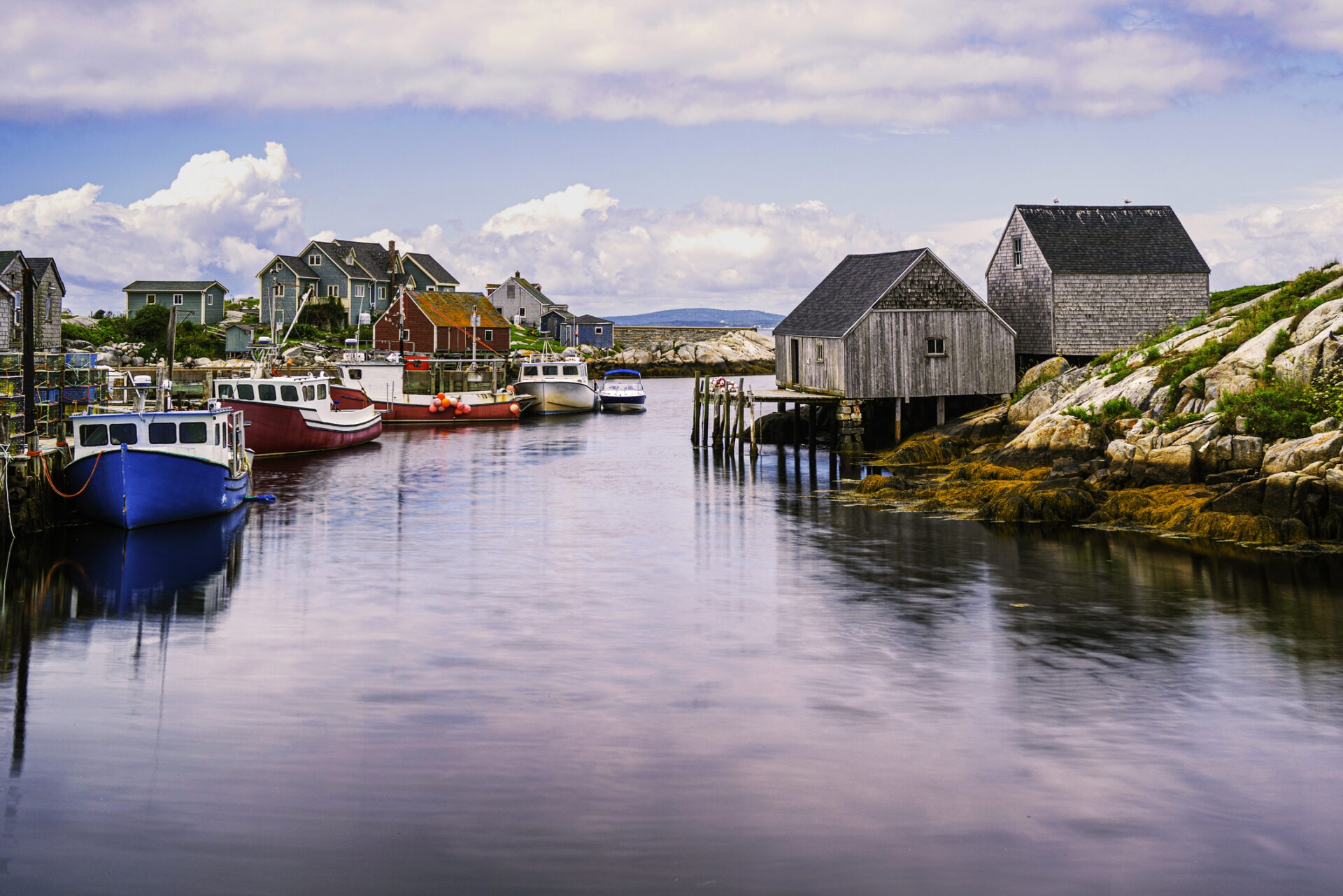 Peggy's Cove Seascape with moored boats and weathered seaside sh