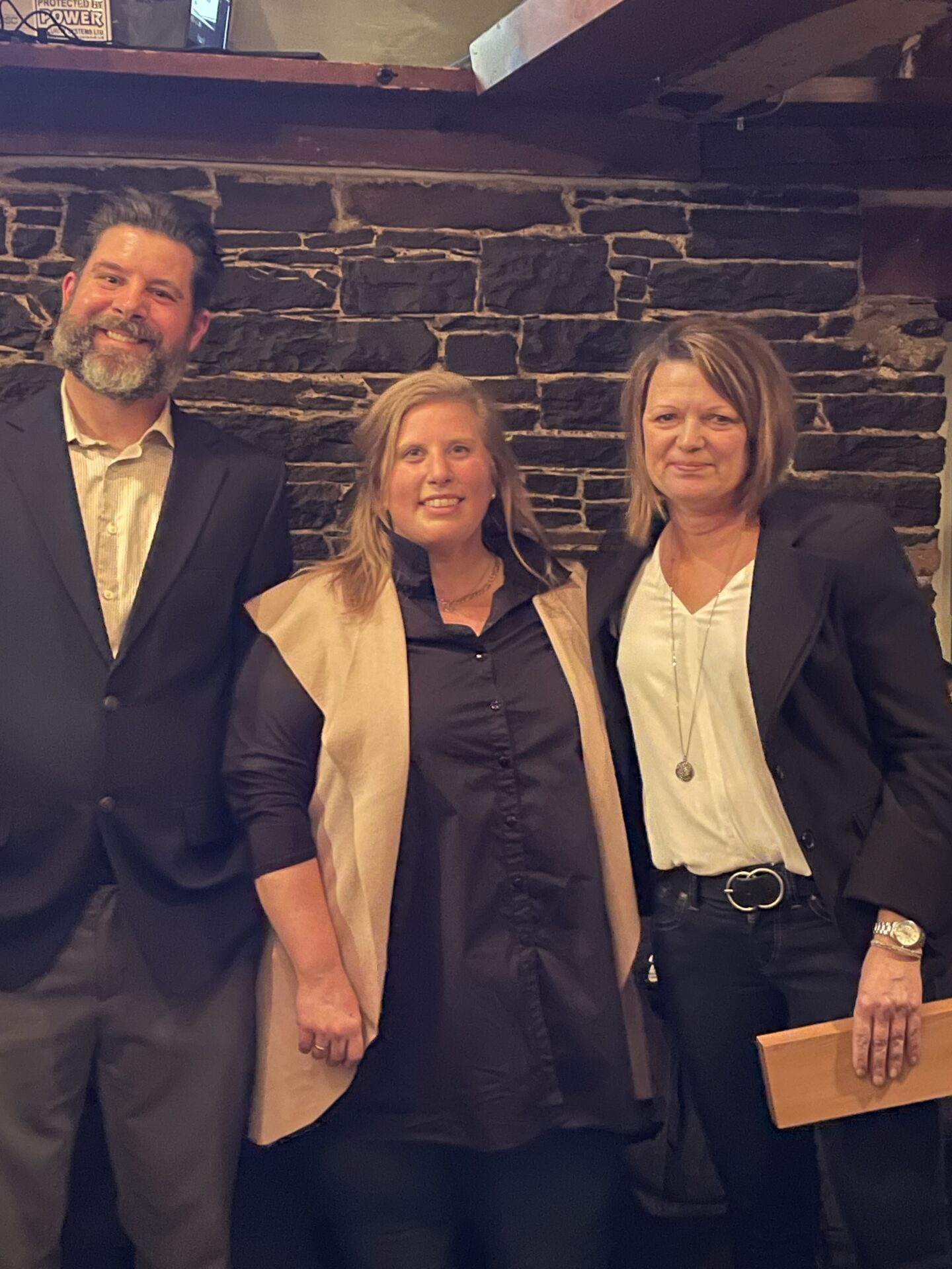 Bonnie Levy (R) receiving Commitment to Industry Education Award for her career at NSCC Kingstec. (L - Andrew Pepper, MC, from The Stone Depot and middle - Michelle Muis, instructor at NSCC and nominator)